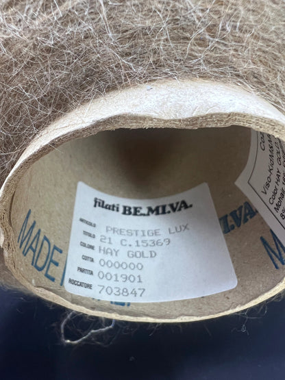 Filati Power Art: Prestige. Lux Fibre: 60% babykid mohair yarn, 16% extrafine merino wool yarn, 26% Nylon yarn, 8% Metallized yarn available at our Yarn Store in Canada. Country: Italy. Color: HAY GOLD. Yarn on cone. 