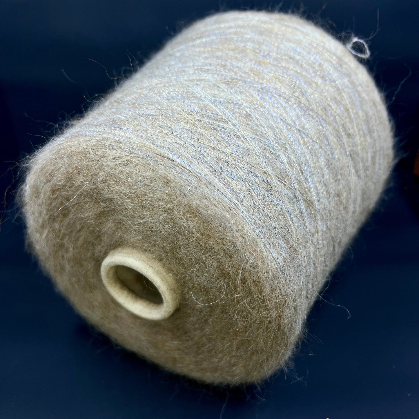 Filati Power Art: Prestige. Lux Fibre: 60% babykid mohair yarn, 16% extrafine merino wool yarn, 26% Nylon yarn, 8% Metallized yarn available at our Yarn Store in Canada. Country: Italy. Color: HAY GOLD. Yarn on cone. 