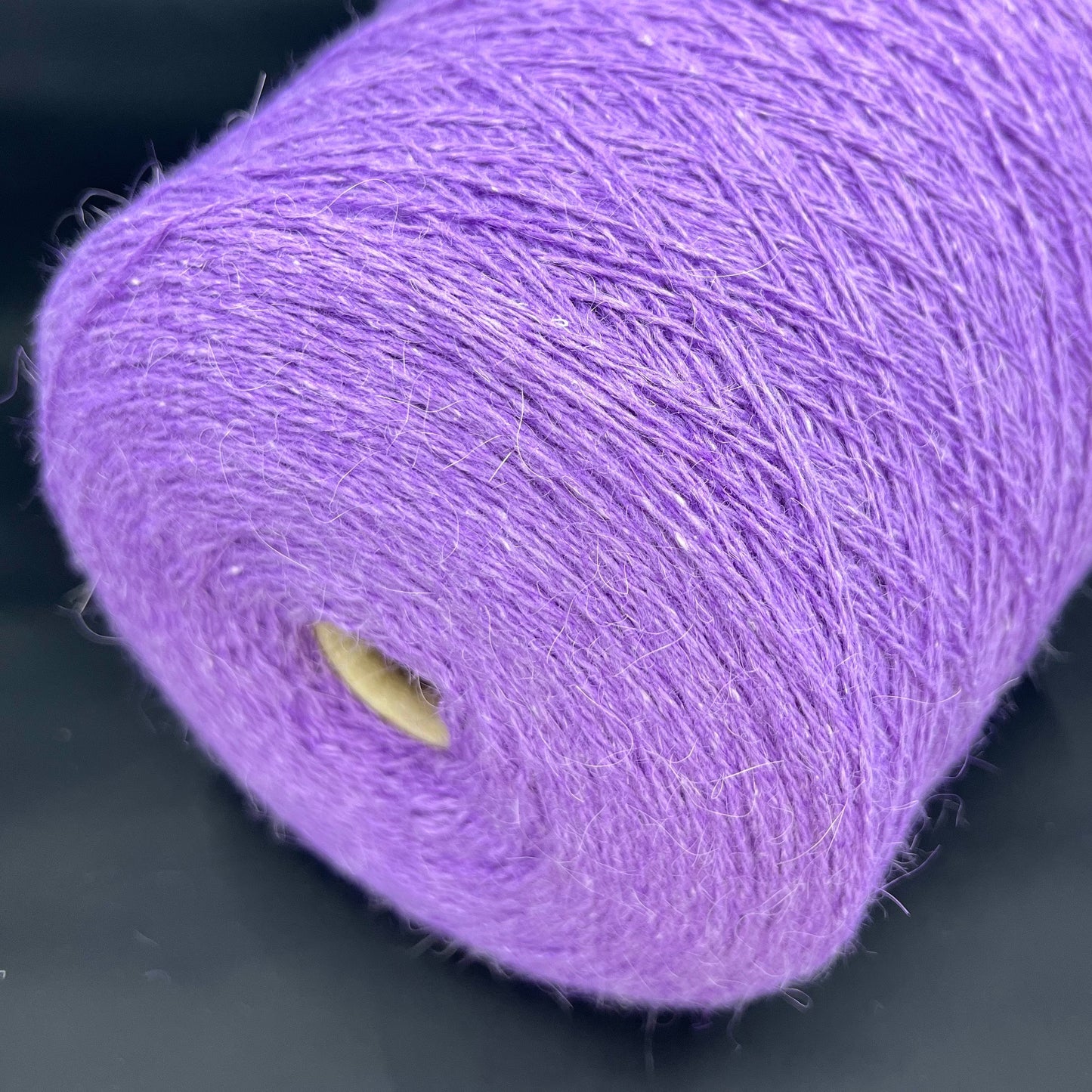 PRPFILO filati art. GINEVRA. Fiber: 20% Angora yarn, 10% Silk yarn, 30% Alpaca yarn, 40% Merino yarn. Colour: Violetta. Yarn in Cone can be purchased at our yarn store. If you need to unwind the purchased yarn into several cones, write to us.