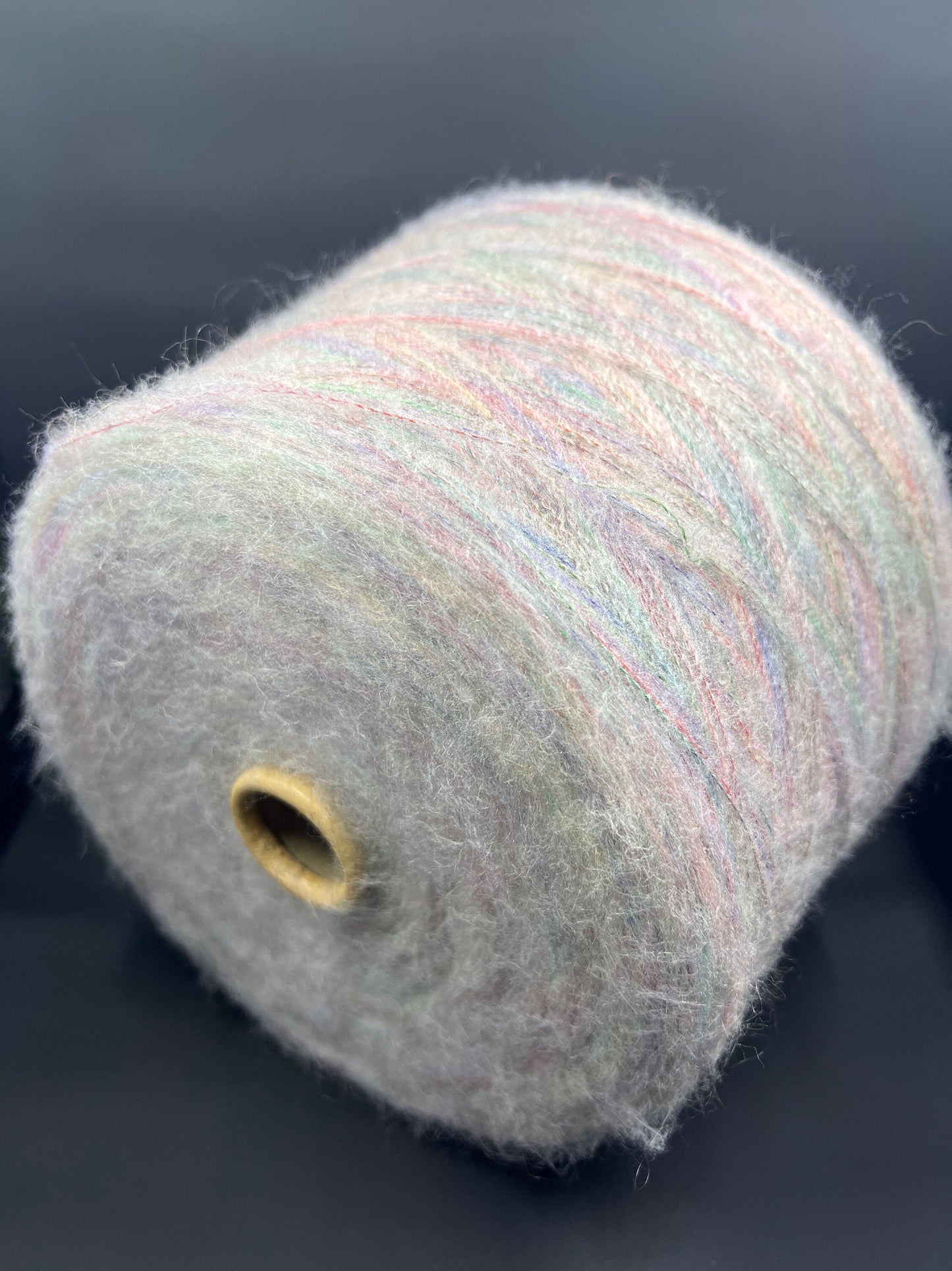 Reference: PROFILO S.N.C. Art: TUI. Fibre: 30% Super kid mohair yarn, 10% Merino wool yarn, 30% Nylon yarn, 30% Acrilico yarn, this yarn can be purchased at our yarn store in Canada. Footage: 900 m per 100 g. Yarn from country: Italy. Yarn Color: ARCOBALENO MEL.  Can be used for knitting (both machine and hand). 