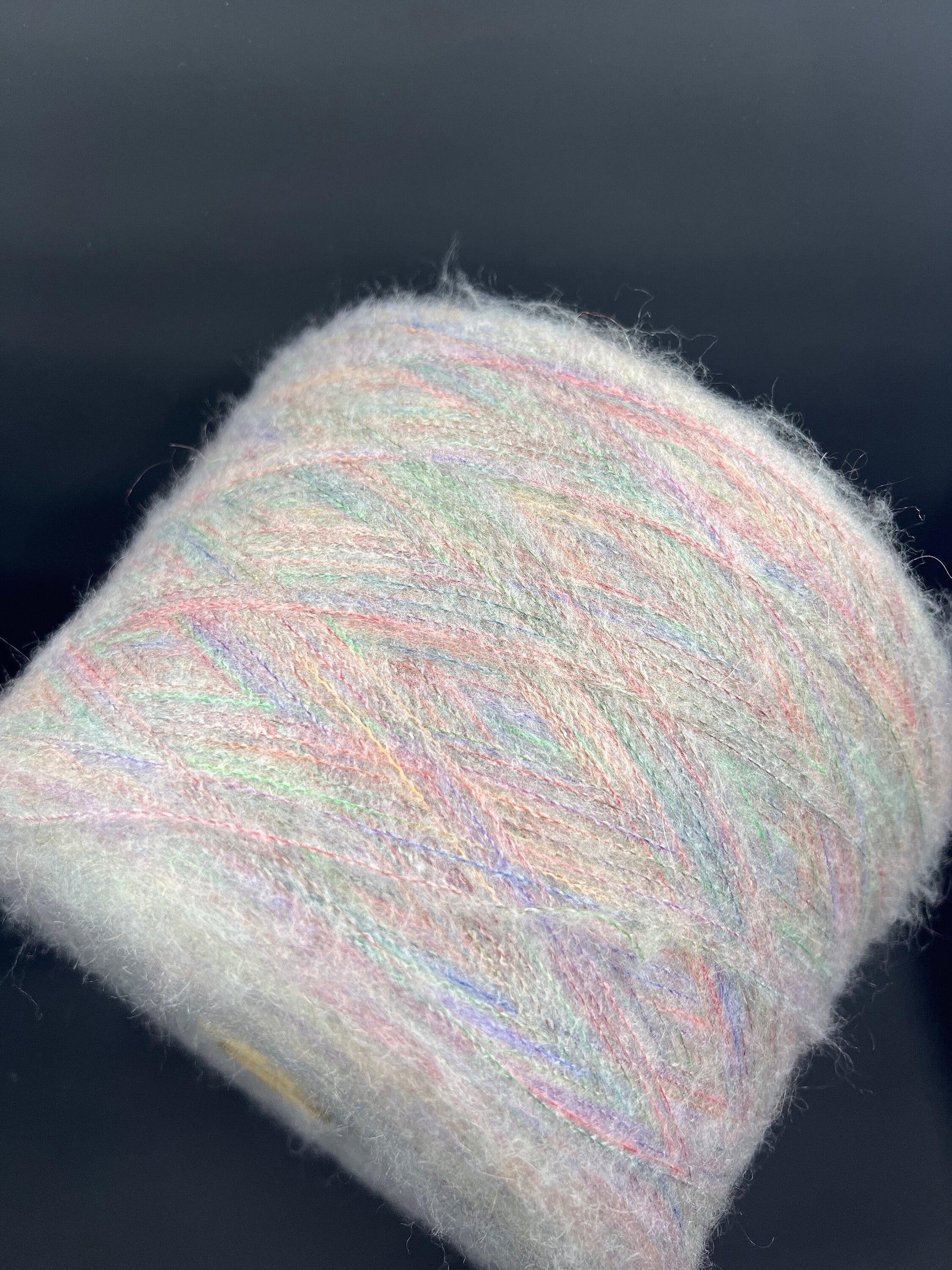 Reference: PROFILO S.N.C. Art: TUI. Fibre: 30% Super kid mohair yarn, 10% Merino wool yarn, 30% Nylon yarn, 30% Acrilico yarn, this yarn can be purchased at our yarn store in Canada. Footage: 900 m per 100 g. Yarn from country: Italy. Yarn Color: ARCOBALENO MEL.  Can be used for knitting (both machine and hand). 