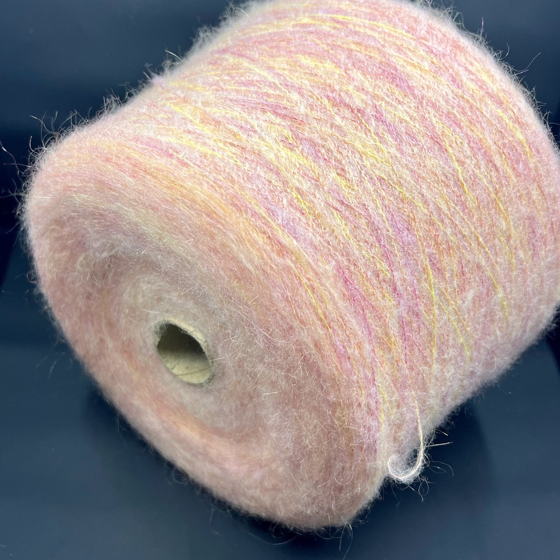 Reference: PROFILO S.N.C. TUI. Fibre: 30% Super kid mohair yarn, 10% Merino wool yarn, 30% Nylon yarn, 30% Acrilico yarn. Yarn from Italy. Yarn Color: ARANCIA MEL. Can be used for knitting (both machine and hand). This yarn can be purchased at our yarn store in Canada.