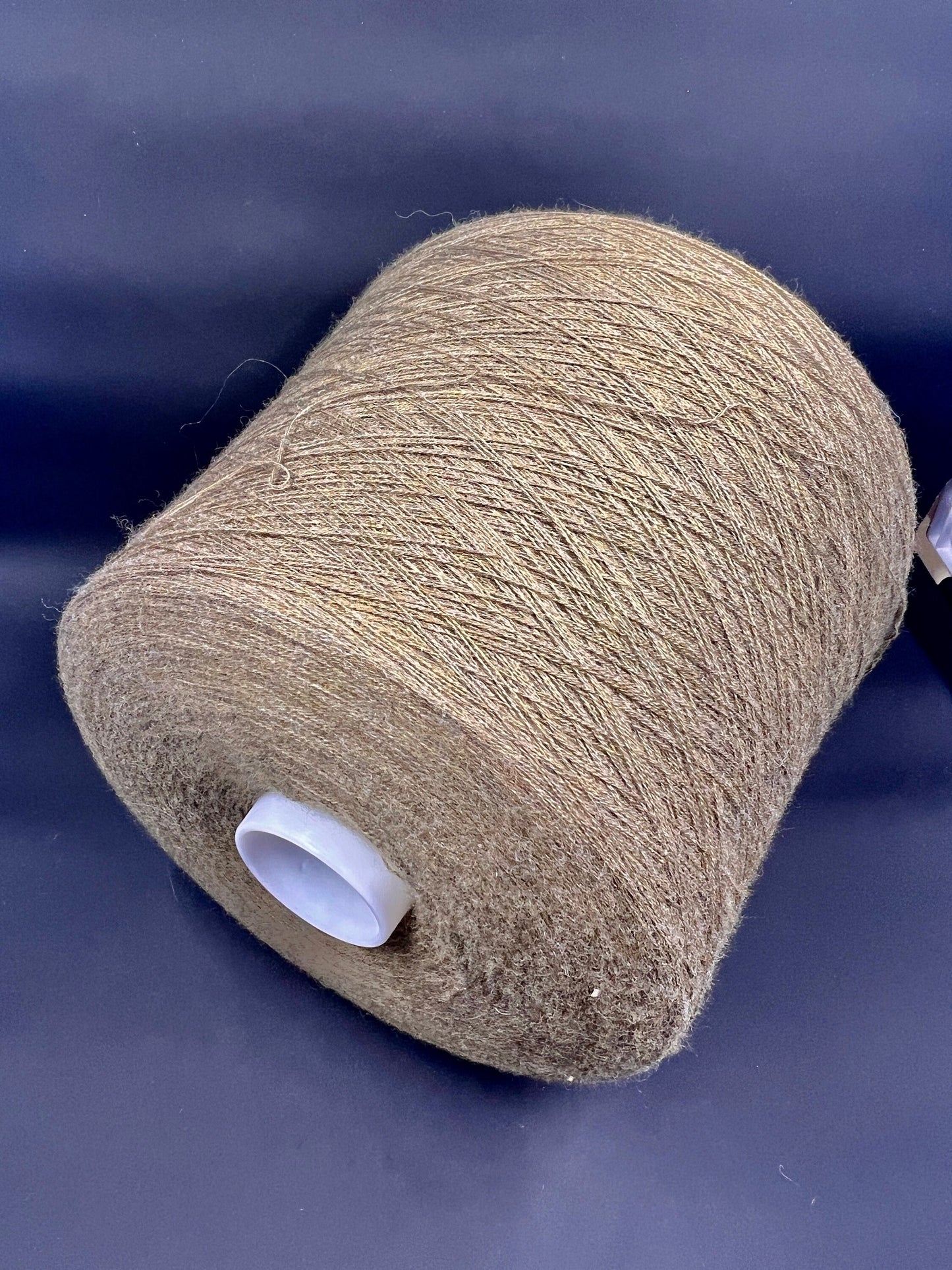 Fiber: 100% Merino wool yarn. Botto Giuseppe art: Slowool Light. Yarn Colour: Tan (Light brown). This is a very soft pure merino wool yarn available in our Yarn Store. It is produced in Italy by one of the best cashmere spinning mill in the world.