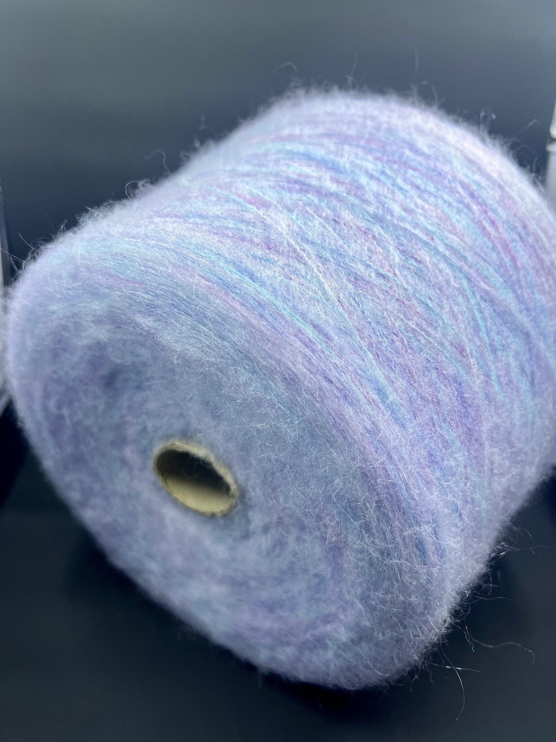 Reference: PROFILO S.N.C. TUI. Fibre: 30% Super kid mohair yarn, 10% Merino yarn, 30% Nylon, 30% Acrilico. Yarn from Country: Italy. Yarn Color: CELESTE MEL. Can be used for knitting (both machine and hand). This yarn can be purchased at our yarn store in Canada.