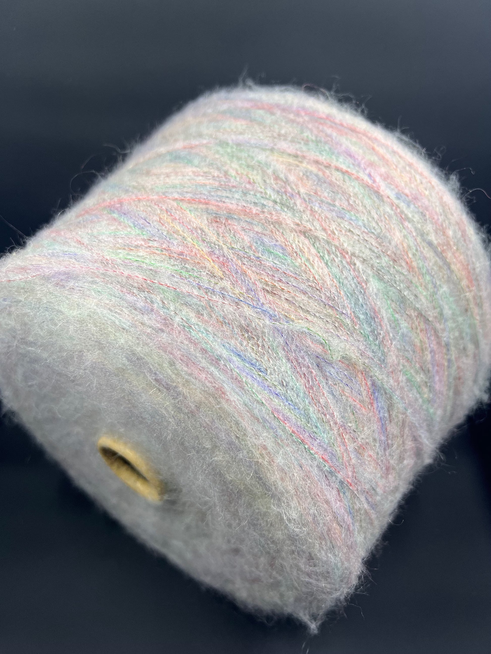 Reference: PROFILO S.N.C. Art: TUI. Fibre: 30% Super kid mohair yarn, 10% Merino wool yarn, 30% Nylon yarn, 30% Acrilico yarn, this yarn can be purchased at our yarn store in Canada. Footage: 900 m per 100 g. Yarn from country: Italy. Yarn Color: ARCOBALENO MEL.  Can be used for knitting (both machine and hand). 