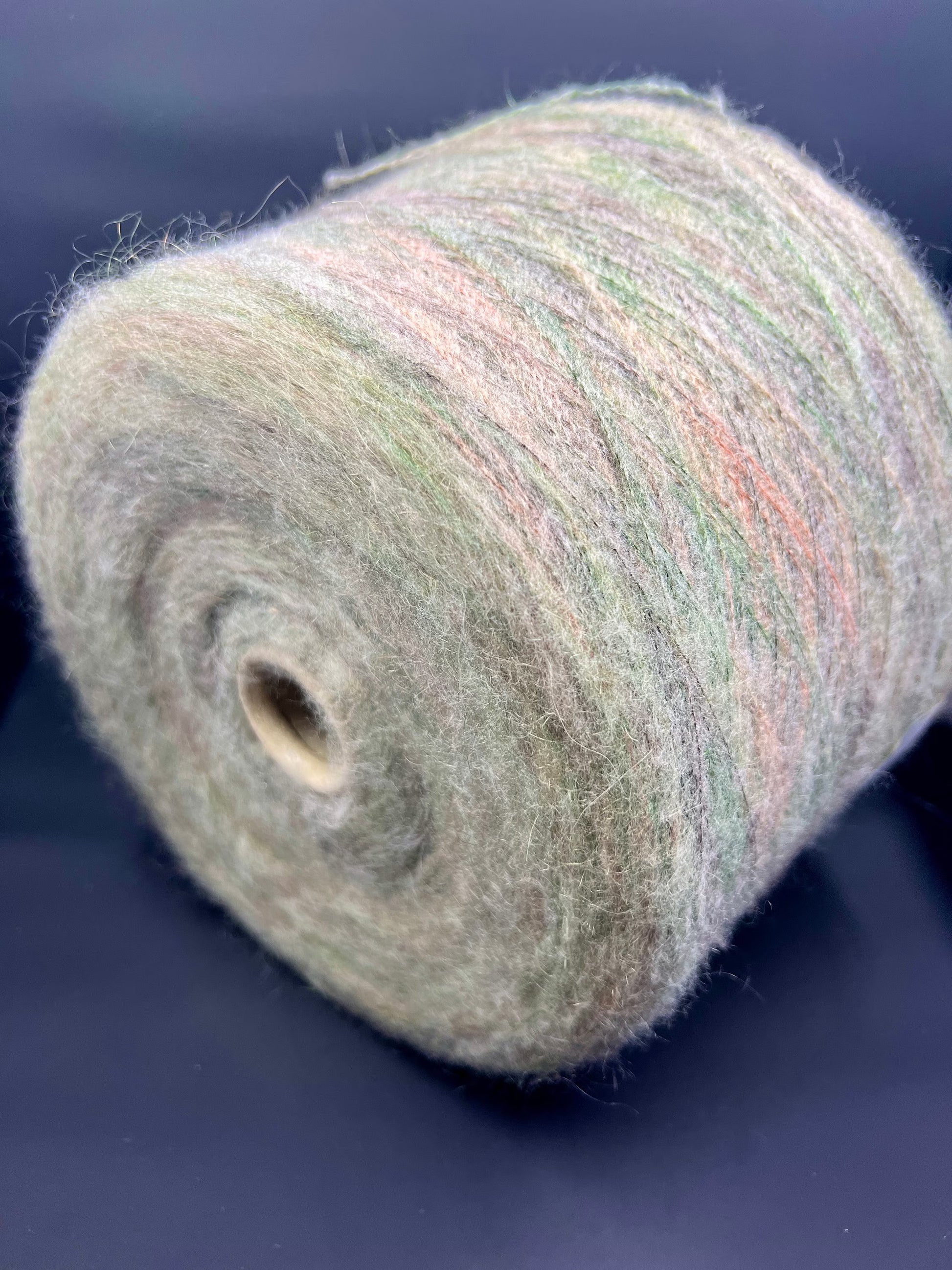 PROFILO Art: TUI. Fibre: 30% Super kid mohair yarn, 10% Merino wool yarn, 30% Nylon yarn, 30% Acrilico yarn. Yarn Color: VER BOSCO MEL. Can be used for knitting (both machine and hand). This is yarn available at our Yarn Store in Canada.