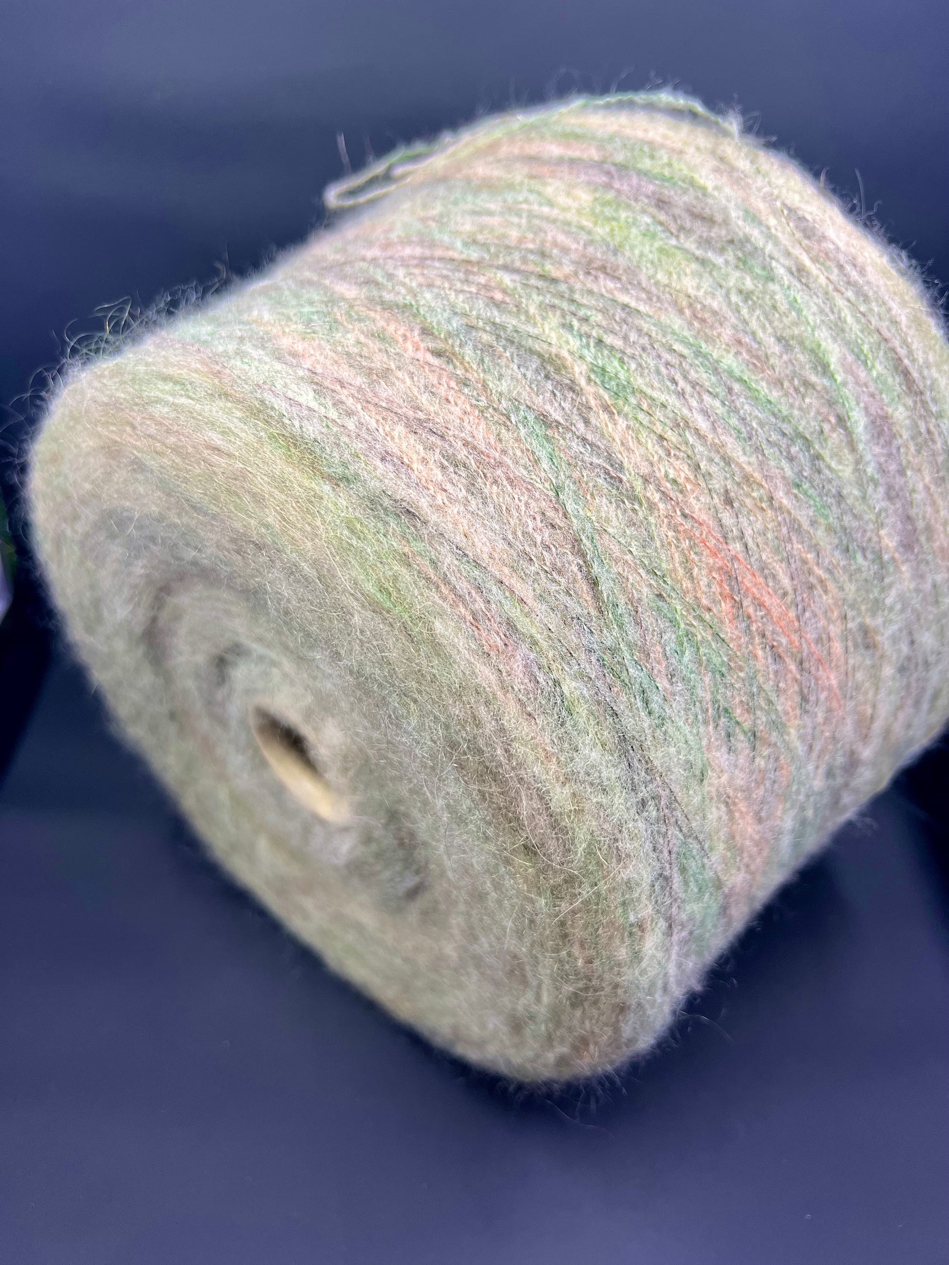 PROFILO Art: TUI. Fibre: 30% Super kid mohair yarn, 10% Merino wool yarn, 30% Nylon yarn, 30% Acrilico yarn. Yarn Color: VER BOSCO MEL. Can be used for knitting (both machine and hand). This is yarn available at our Yarn Store in Canada.