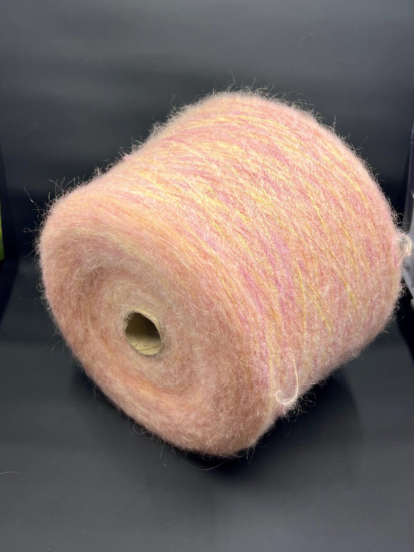 Reference: PROFILO S.N.C. TUI. Fibre: 30% Super kid mohair yarn, 10% Merino wool yarn, 30% Nylon yarn, 30% Acrilico yarn. Yarn from Italy. Yarn Color: ARANCIA MEL. Can be used for knitting (both machine and hand). This yarn can be purchased at our yarn store in Canada.