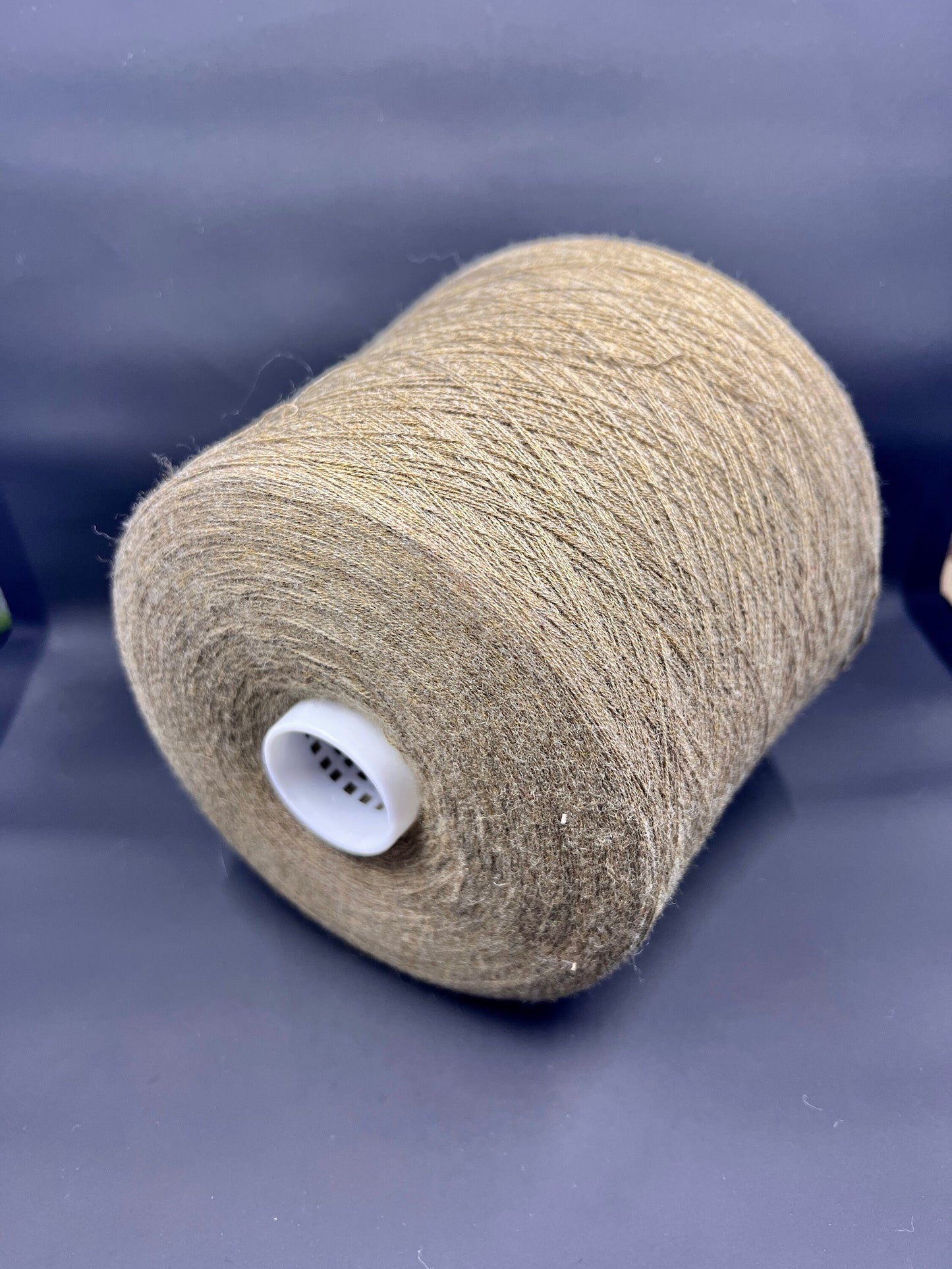 Fiber: 100% Merino wool yarn. Botto Giuseppe art: Slowool Light. Yarn Colour: Tan (Light brown). This is a very soft pure merino wool yarn available in our Yarn Store. It is produced in Italy by one of the best cashmere spinning mill in the world.