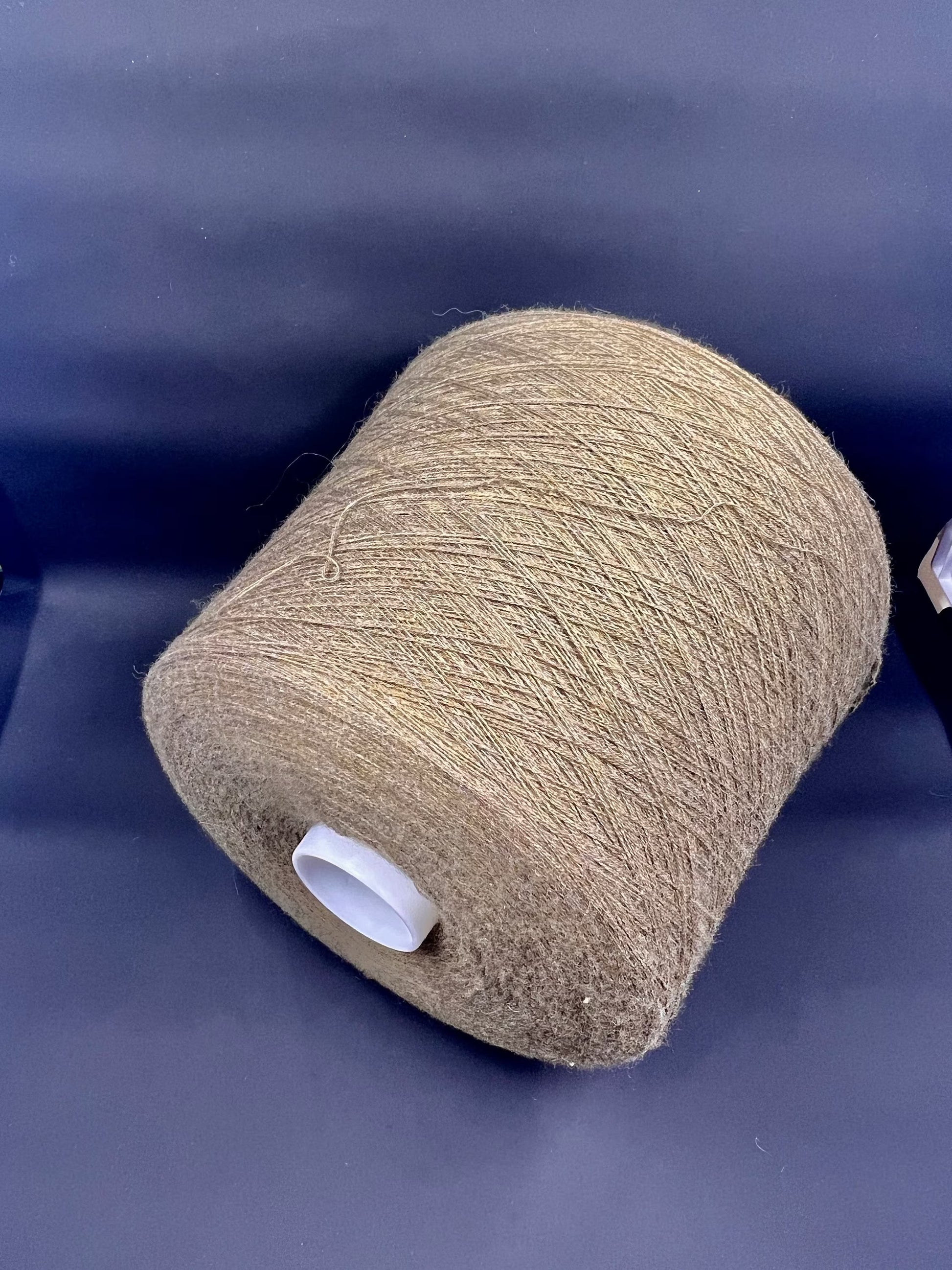 Fiber: 100% Merino wool yarn. Botto Giuseppe art: Slowool Light. Yarn Colour: Tan (Light brown). This is a very soft pure merino wool yarn available in our Yarn Store. It is produced in Italy by one of the best cashmere spinning mill in the world.