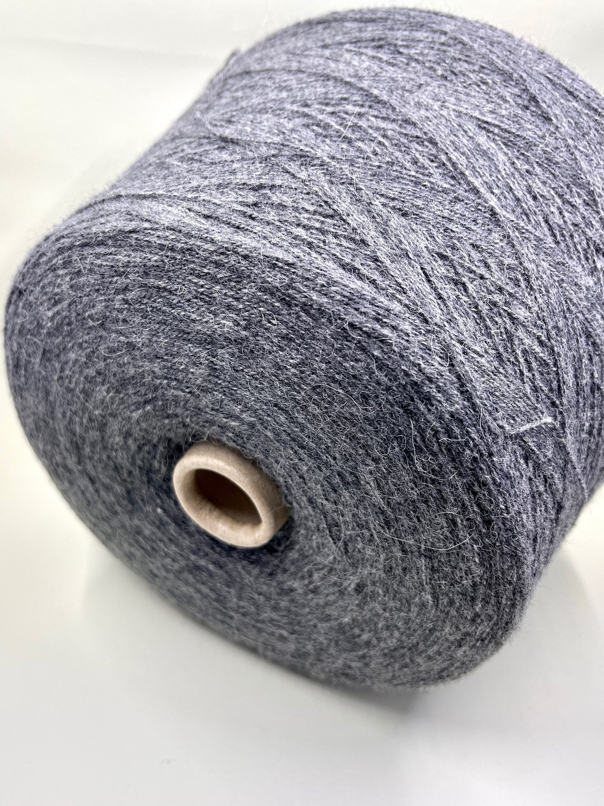 Reference: Profillo TULUM. Fibre: 85% Alpaca yarn, 15% merino wool yarn. Footage: 600m per 100g/ 656 yard per 3.35oz. Country: Italy. Yarn Color: Grigio CHI. Can be used for knitting (both machine and hand). This yarn is available in our Store in Canada.