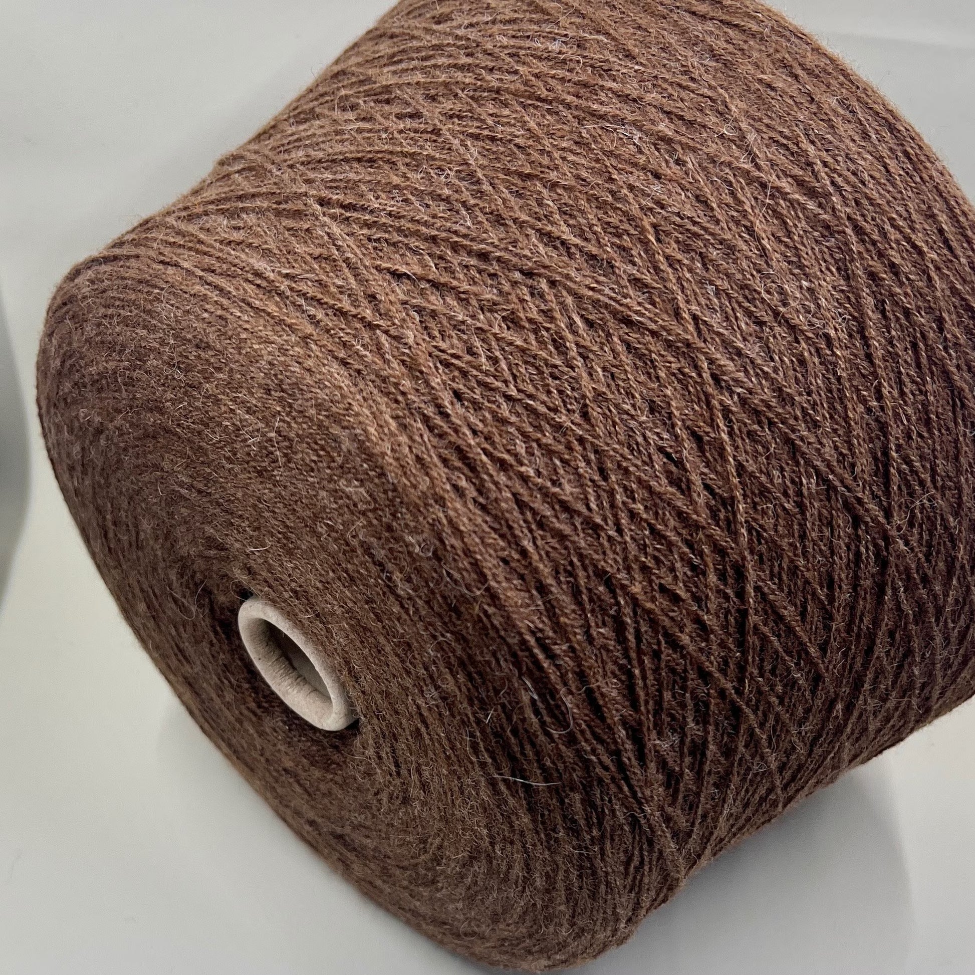 Fibre: 85% Alpaca Yarn, 15% merino wool yarn, Yarn on Cone. Reference: Profillo Nm 2/12000 TULUM. Weight: your choice Footage: 600m per 100g/ 656 yard per 3.35oz. Country: Italy. Color: Castore Mel. Can be used for knitting (both machine and hand). All purchased yarn from 100g is unwound on one cone. If you buy less than 100 grams and want cone yarn, please contact me.We do not wind the yarn in several layers, but at your request we unwind it into several cones.