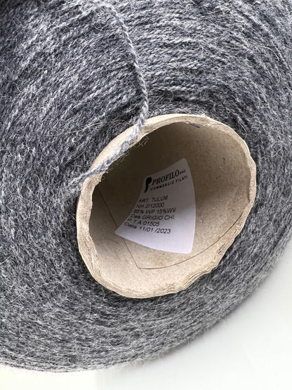 Reference: Profillo TULUM. Fibre: 85% Alpaca yarn, 15% merino wool yarn. Footage: 600m per 100g/ 656 yard per 3.35oz. Country: Italy. Yarn Color: Grigio CHI. Can be used for knitting (both machine and hand). This yarn is available in our Store in Canada.