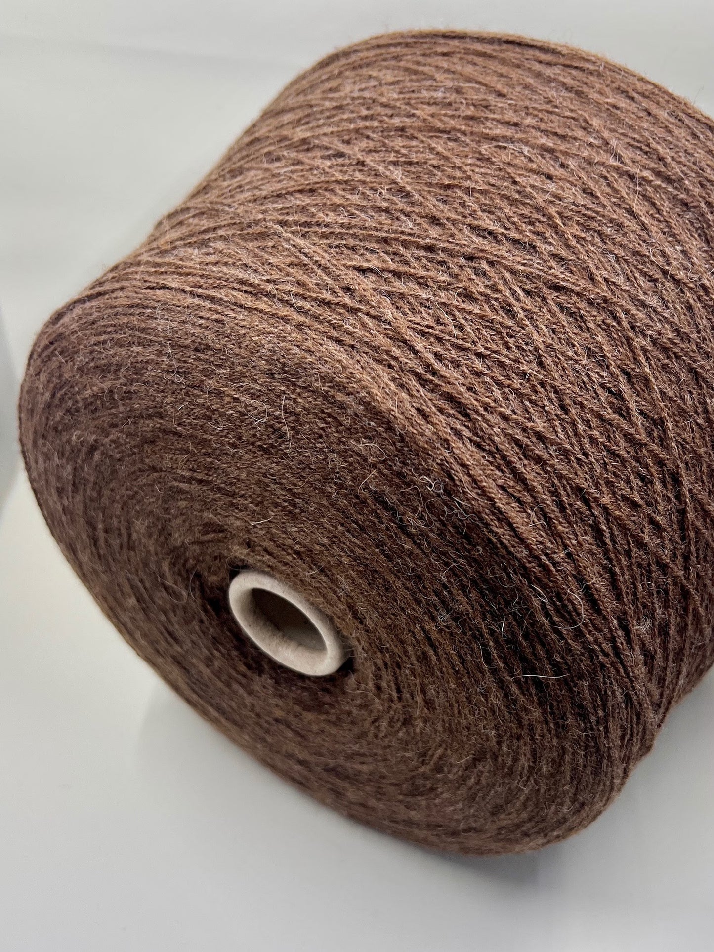 Fibre: 85% Alpaca Yarn, 15% merino wool yarn, Yarn on Cone. Reference: Profillo Nm 2/12000 TULUM. Weight: your choice Footage: 600m per 100g/ 656 yard per 3.35oz. Country: Italy. Color: Castore Mel. Can be used for knitting (both machine and hand). All purchased yarn from 100g is unwound on one cone. If you buy less than 100 grams and want cone yarn, please contact me.We do not wind the yarn in several layers, but at your request we unwind it into several cones.