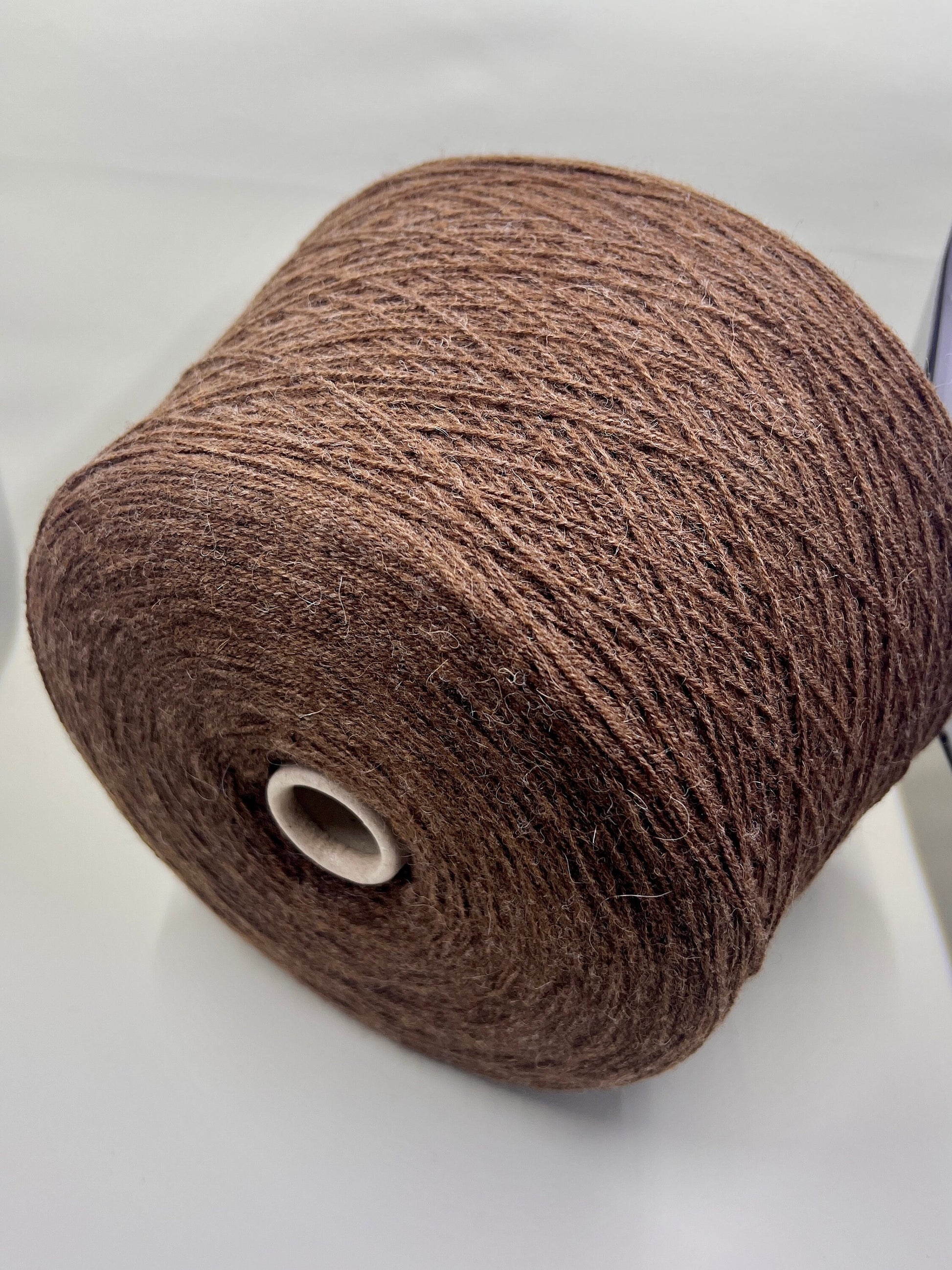 Fibre: 85% Alpaca Yarn, 15% merino wool yarn, Yarn on Cone. Reference: Profillo Nm 2/12000 TULUM. Weight: your choice Footage: 600m per 100g/ 656 yard per 3.35oz. Country: Italy. Color: Castore Mel. Can be used for knitting (both machine and hand). All purchased yarn from 100g is unwound on one cone. If you buy less than 100 grams and want cone yarn, please contact me.We do not wind the yarn in several layers, but at your request we unwind it into several cones.