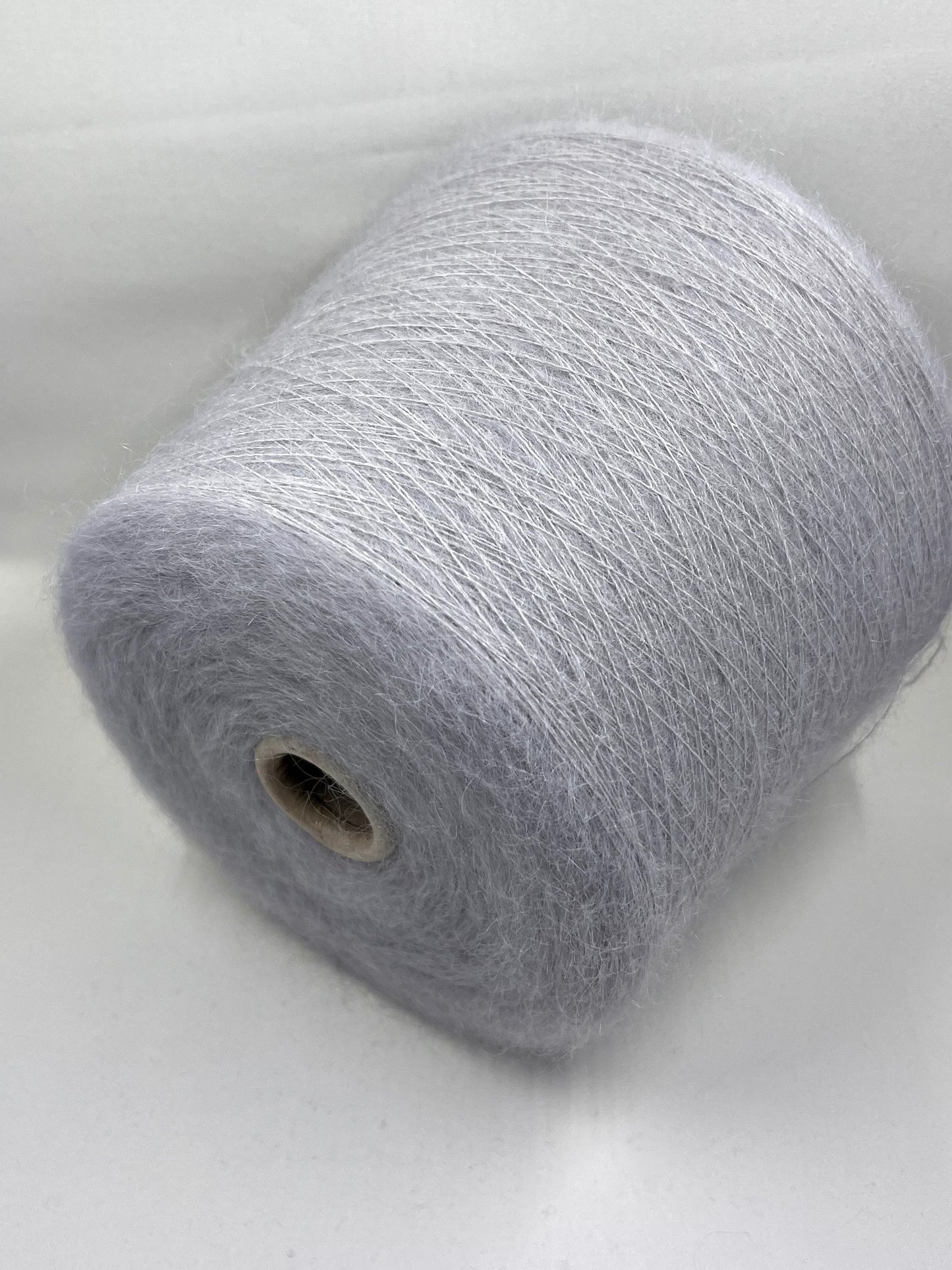 Super Kid Mohair Yarn. Yarn on Cone. Kid Mohair Yarn for Hand & Machine Knitting.  Fiber: 70% Kid Mohair Yarn & 30% Silk Yarn.  Reference: Profilo, Nm 1/9000 This is a very soft pure Kid Mohair yarn by Profilo.