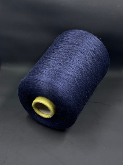 Fiber: 100% silk yarn. Italian yarn for hand and machine knitting. Country: Italy. Color: midnight blue. Silk yarn is a luxurious and versatile material. This silk yarn is ideal for machine knitting. Packing the yarn on a cone ensures that the silk yarn stays organized and tangle-free, allowing you to knit evenly and without interruptions.