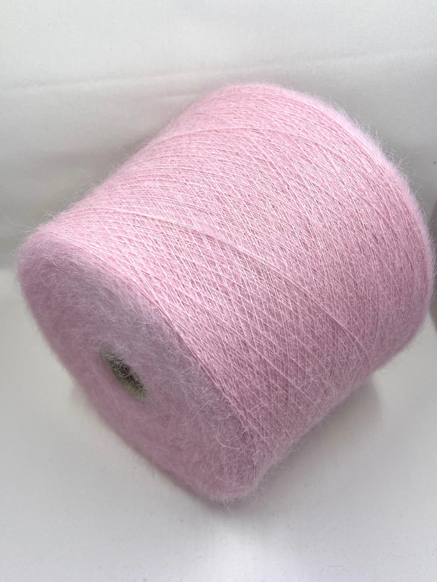 Super Kid Mohair Yarn. Yarn on Cone. Kid Mohair Yarn for Hand & Machine Knitting.  Fiber: 70% Kid Mohair Yarn & 30% Silk Yarn.  Reference: Profilo, Nm 1/9000 This is a very soft pure Kid Mohair yarn by Profilo.