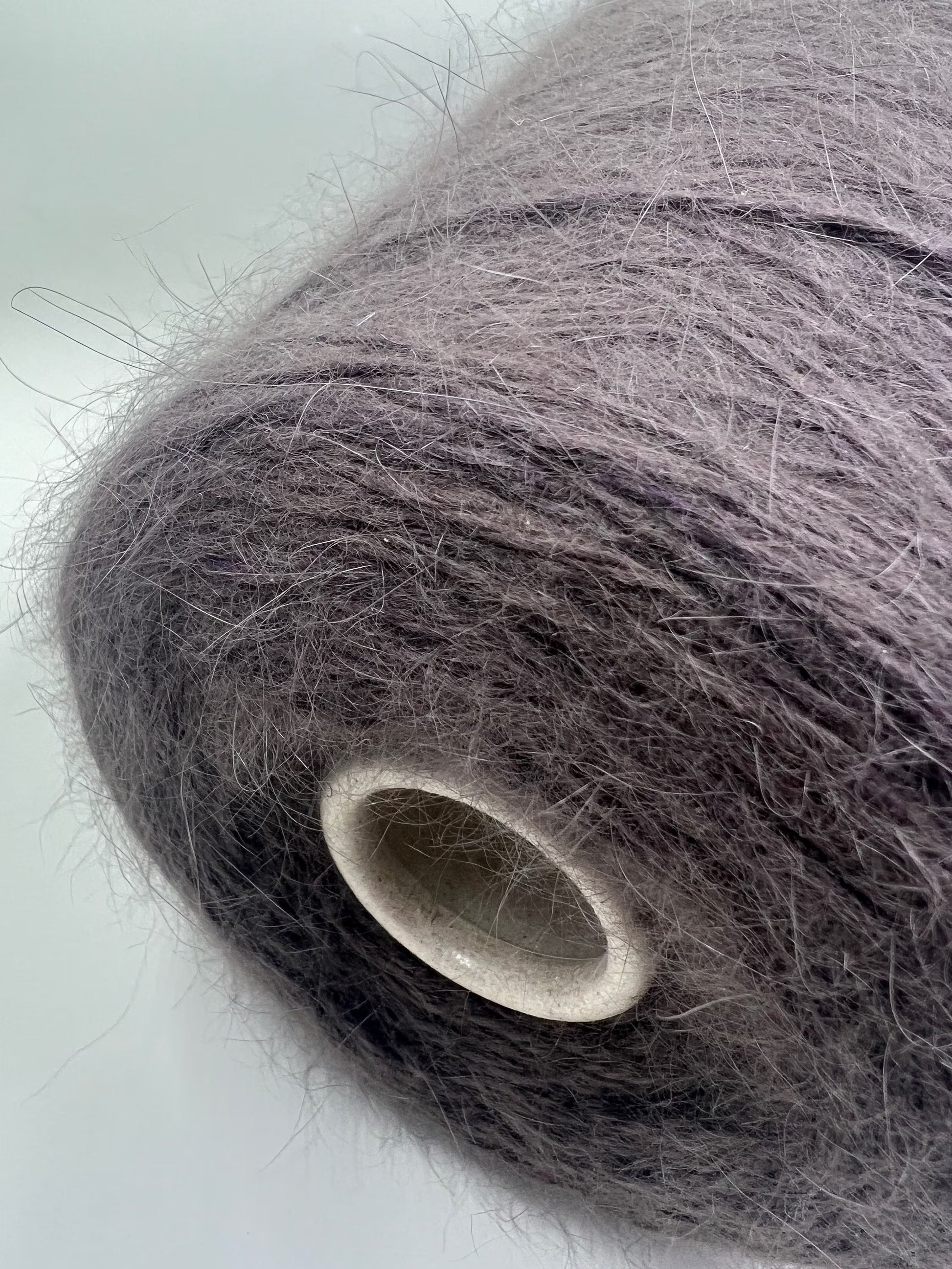 Angora blend Yarn by Profilo. Angora Yarn for Hand & Machine Knitting. Yarn on Cone. Fiber: 80% Angora Yarn & 20% Poliamide. Yarn Colour: Taupe. Reference: Profilo, Nm 2/10 This is a very soft pure Angora blend yarn by Profilo.