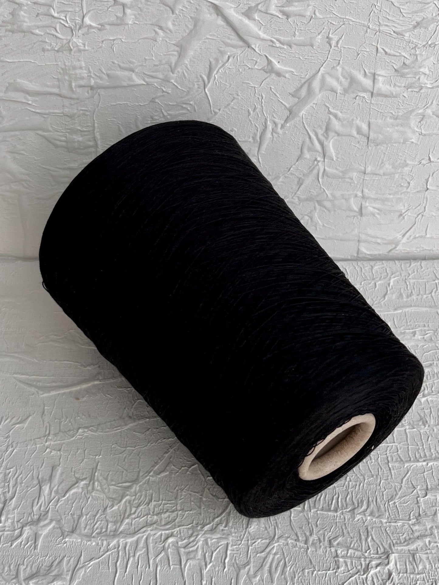 55% Silk Yarn, Cotton Yarn 45%, Yarn on Cone, Zegna Baruffa. Color Black. Per 100 gr