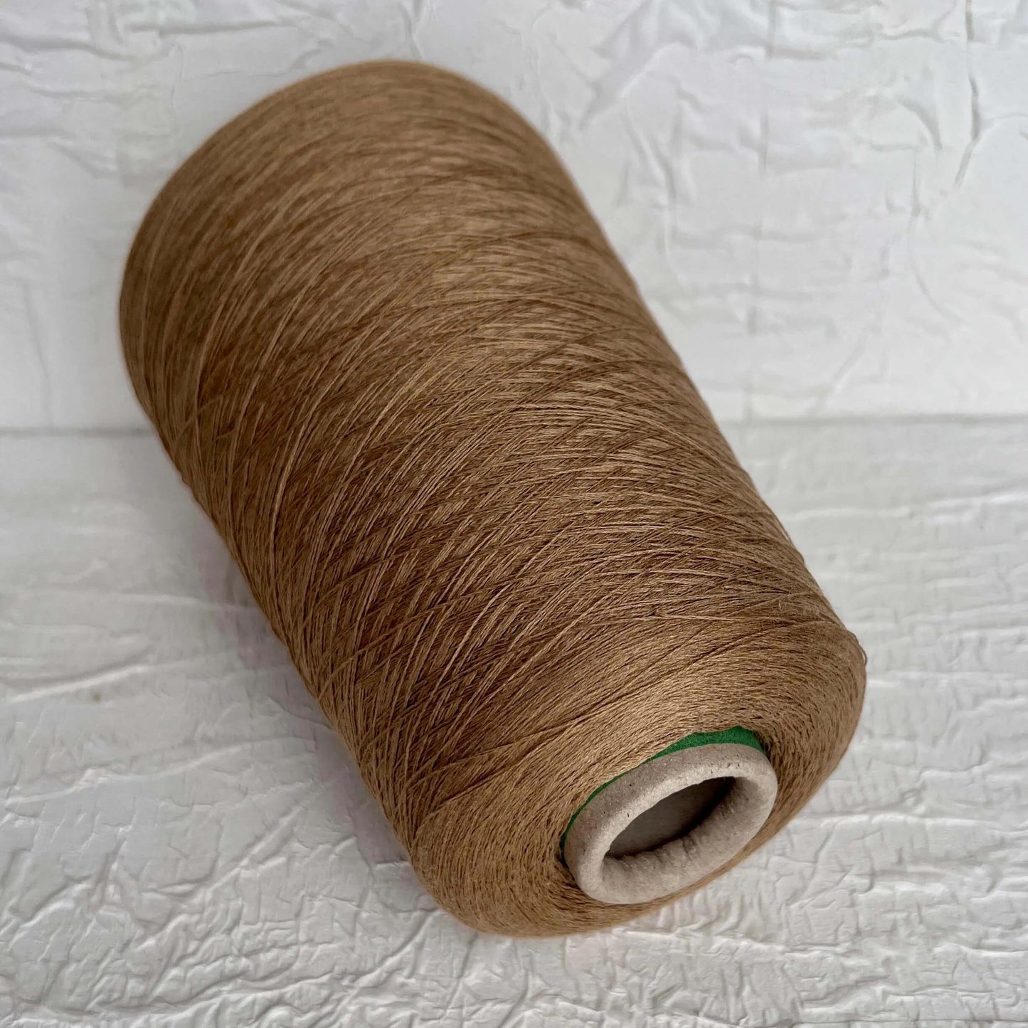 Silk Yarn 55%, Cotton Yarn 45%, Yarn on Cone. Color Stone Brown. Per 100 gr