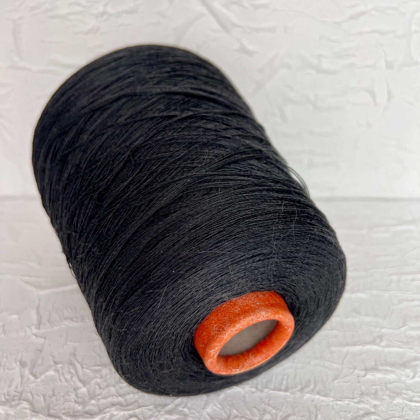 Silk Yarn 59%, Cotton Yarn 41%, Yarn on Cone. Color Carbon Gray. Per 100 gr