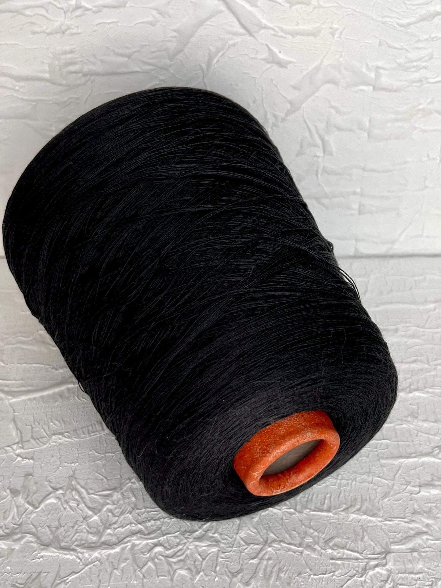 Silk Yarn 59%, Cotton Yarn 41%, Yarn on Cone. Color Carbon Gray. Per 100 gr