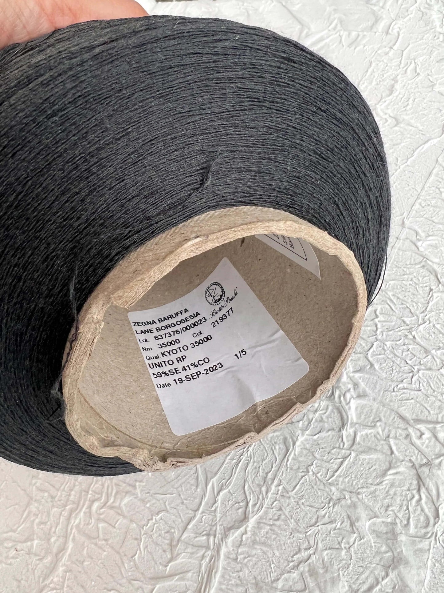 Silk Yarn 59%, Cotton Yarn 41%, Yarn on Cone. Color Carbon Gray. Per 100 gr