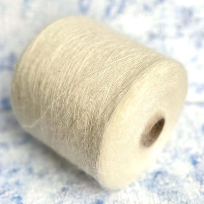 SuperKidMohair Yarn 67%, PA Yarn 30%, Merino Yarn 3%. Yarn on Cone,  Color White. Per 100 gr