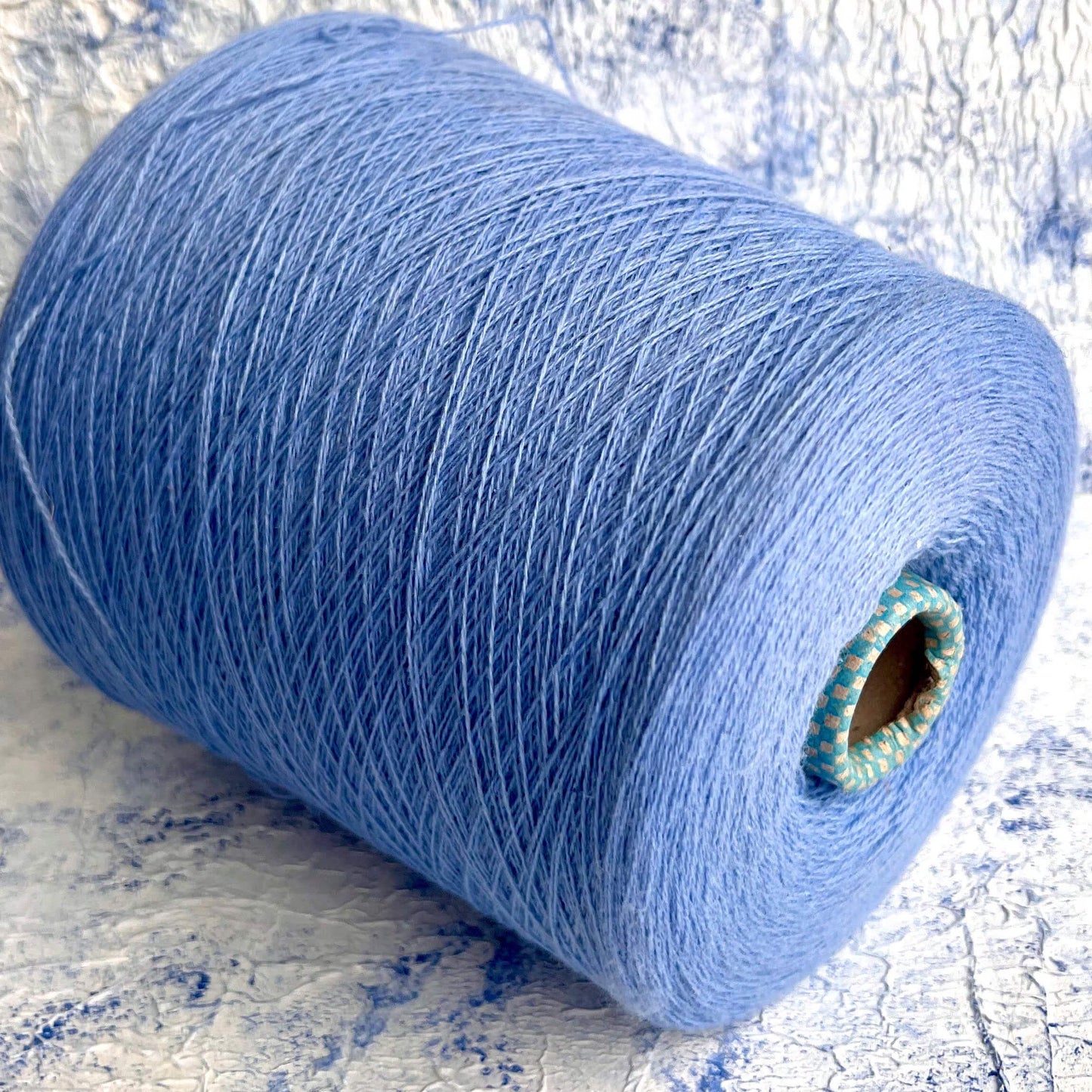 Cashmere lace yarn on cone Italian Fine Yarn for Hand Knitting or Machine Knitting.
100% Cashmere yarn. Cariaggi yarn Nm 2/28
Fiber: 100% Cashmere Yarn by Cariaggi
Yardage: 1400m per 100g / 1531 yards per 3.52oz
Colour: Egiptian Blue. This is a very soft pure cashmere yarn.