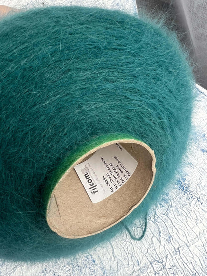 Angora yarn 80%,Poliamide Yarn 20%,Color Turquoise. Per 100 gr