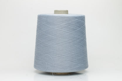 Close-up of pale frost blue 100% cotton yarn, exhibiting a tightly spun 4-ply structure with a soft, uniform sheen and smooth texture.