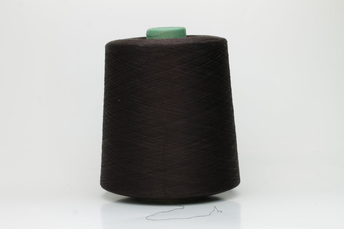 Close-up of smooth, dark Bitter Chocolate cotton yarn, tightly plied for a refined, lustrous finish. Shows even twist and deep, rich color.