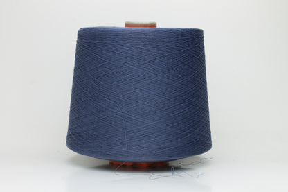 Close-up of finely spun, matte-finish cotton yarn in a rich, multi-toned classic denim blue heather, revealing subtle variations and a smooth, consistent two-ply twist.