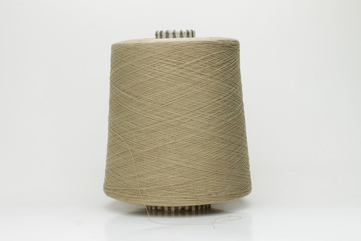 Close-up of finely spun Khaki Beige Heather 100% cotton yarn, exhibiting a soft, matte sheen and a gentle two-ply twist. The sophisticated blend of khaki and beige fibers creates a nuanced, earthy tone.