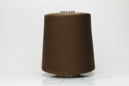 Smooth, tightly twisted two-ply cotton yarn in a rich, warm chestnut brown. Displays a subtle sheen and fine, even thread structure.