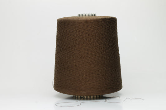 Smooth, tightly twisted two-ply cotton yarn in a rich, warm chestnut brown. Displays a subtle sheen and fine, even thread structure.