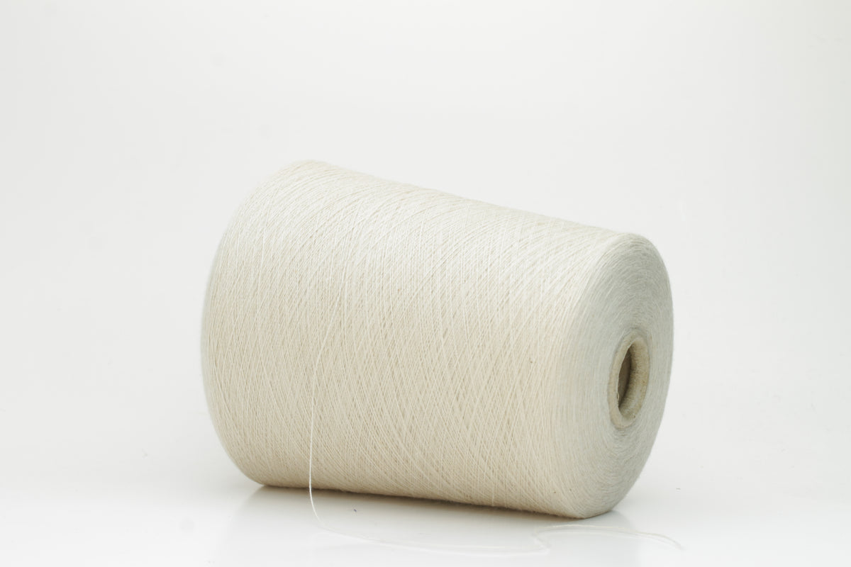 Close-up of a neatly wound cone of fine, smooth 4-ply cotton yarn in a soft off-white hue, showing a subtle matte sheen and even twist.