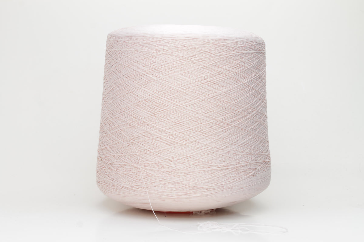 Close-up of a smooth, twisted, three-ply premium nylon yarn in a soft, elegant rose pink shade, exhibiting a subtle sheen and consistent strand structure.