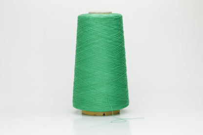Close-up of a single strand of lustrous, single-ply 100% silk yarn in a vibrant mint green, showcasing its smooth texture and elegant sheen.
