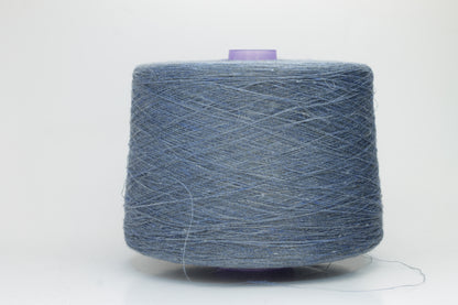 Fine, single-ply linen yarn in a rich Denim. Reveals a crisp texture and subtle natural sheen, typical of pure linen fiber.
