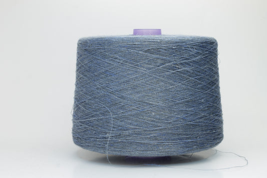 Fine, single-ply linen yarn in a rich Denim. Reveals a crisp texture and subtle natural sheen, typical of pure linen fiber.