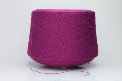 Close-up studio shot showcasing the rich purple color of Zegna Baruffa Merino Cashwool yarn. The yarn features a dense, twisted ply construction with a subtle sheen and inviting fluffiness.