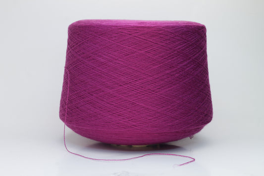 Close-up studio shot showcasing the rich purple color of Zegna Baruffa Merino Cashwool yarn. The yarn features a dense, twisted ply construction with a subtle sheen and inviting fluffiness.