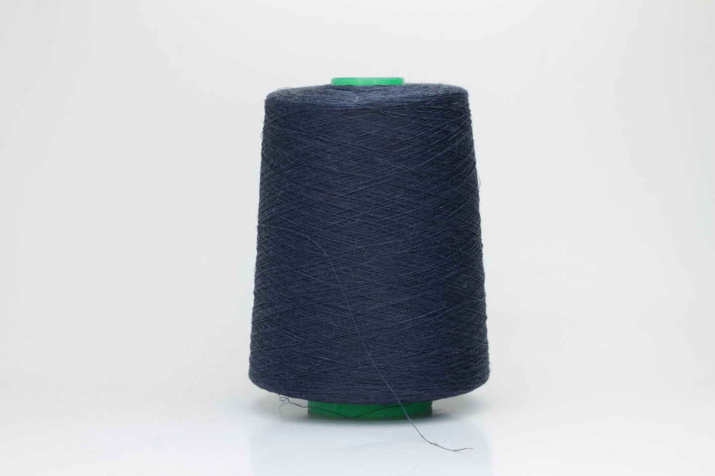 Fine, single-ply linen yarn in a rich Marina. Reveals a crisp texture and subtle natural sheen, typical of pure linen fiber.