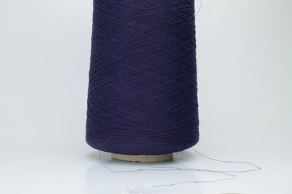 Close-up of a smooth, single-ply navy linen blend yarn, with a fine, crisp texture and subtle, natural sheen.