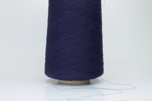 Close-up of a smooth, single-ply navy linen blend yarn, with a fine, crisp texture and subtle, natural sheen.