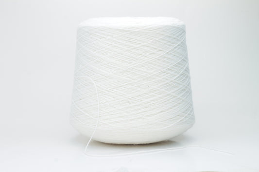 Close-up of a pure white cashmere yarn skein, showcasing its soft, slightly fluffy texture and subtle sheen with a gently twisted, fine two-ply structure.
