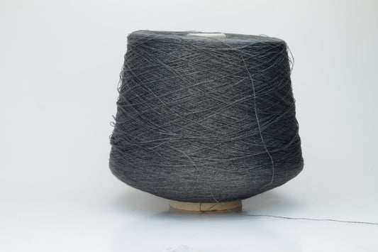 Close-up of a neatly wound skein of fine, smooth brownish-grey linen yarn, exhibiting subtle natural slub variations and a gentle matte sheen.