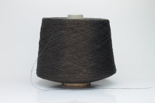 Close-up of a tightly twisted, smooth dark chocolate brown yarn strand, likely two-ply, with a subtle natural sheen.